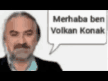 a man with a beard is talking with a speech bubble that says `` merhaba ben volkan konak '' .