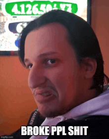 a man is making a funny face with the words broke ppl shit below him