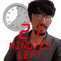 a man with glasses stands in front of a clock that says minutes left