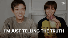 two young men sitting next to each other with the words " i 'm just telling the truth "