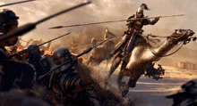 a man on a camel is holding a spear in a battle