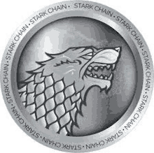 a silver coin with a wolf on it and the words `` stark chain '' written around it .