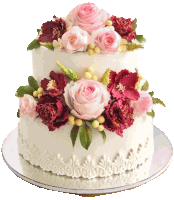 a white cake with pink roses and red carnations on it