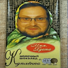 a man with glasses and a scarf on his head is on the cover of a book