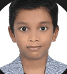 a close up of a young boy 's face in a picture frame .