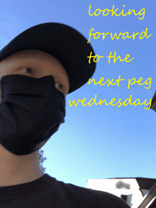 a man wearing a black face mask and a black hat is looking forward to the next pay wednesday