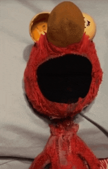 a stuffed animal with elmo 's face on it