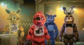 a group of five nights at freddy 's characters are standing in a room .