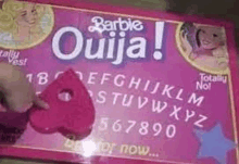 a pink barbie ouija board with a heart on it