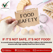 a hand holds a piece of paper that says food safety