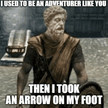 a statue of a man with a shield says i used to be an adventurer like you