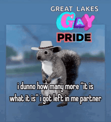 a squirrel wearing a cowboy hat is standing in front of a sign that says " great lakes gay pride "