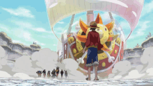 a man in a straw hat is standing in front of a ship that looks like the sun