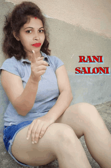 a woman sitting on the ground with the name rani saloni on the bottom