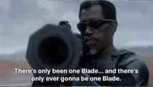 a man is holding a gun and says there 's only been one blade and there 's only ever gonna be one