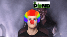 a man wearing a clown wig and a red nose stands in front of a sign that says pond