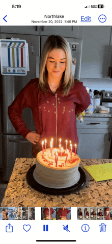 a woman is blowing out candles on a birthday cake that says northlake on it