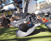 a woman is laying on a chair that says air