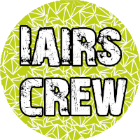 a green circle with the words lairs crew written in black