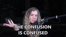 a woman in front of a microphone with the words the confusion is confused