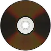 a brown cd with a white center and a white ring around it