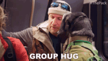 a man and a dog on a bus with the words group hug on the bottom