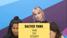 a yellow sign that says salted yams yams salt vegemite on it