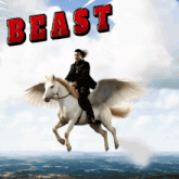 a man riding on the back of a winged horse with the word beast behind him