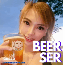 a woman is holding a glass of beer with a cat on it