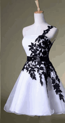 a black and white dress on a mannequin .