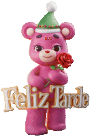 a pink teddy bear is holding a red rose and a sign that says " feliz tarde "