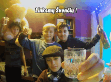 a group of young boys are posing for a picture with the caption linksmy svenciu !