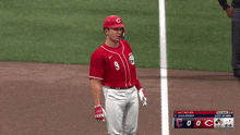 a baseball player wearing a red jersey with the number 9