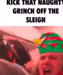 a woman is wearing a christmas hat and screaming while sitting in a car .