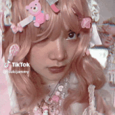 a close up of a woman 's face with tiktok written on the bottom right