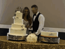 a bride and groom are cutting their wedding cake with a topper that says " i love you "