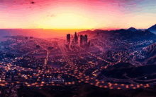 an aerial view of a city at sunset with a pink sky