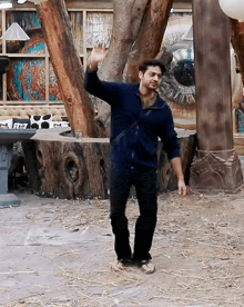 a man is dancing in front of a large eye