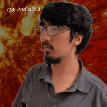 a man with glasses and a beard is pointing at something with the words rpg mid atk 3 below him