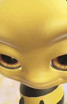 a close up of a yellow and black cartoon character with big eyes