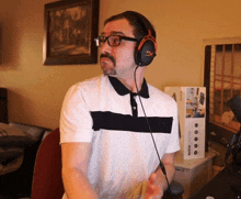 a man wearing a pair of headphones with the word hyper on them