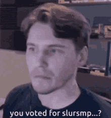 a man in a black shirt is saying you voted for slursmp