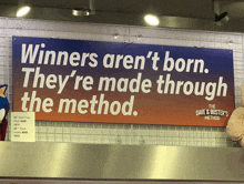 a sign that says winners aren 't born they re made through the method