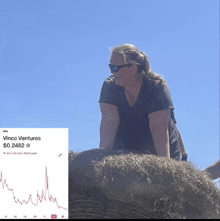 a woman sitting on a bale of hay next to a graph that says vinoo ventures