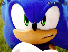 a close up of sonic the hedgehog 's face with an x in the top right corner