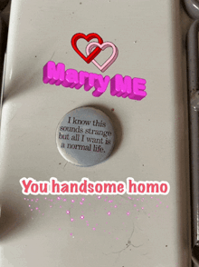 a button that says " marry me " on it