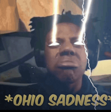 a picture of a man with lightning coming out of his eyes and the words ohio sadness