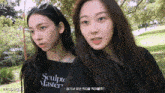 two girls are standing next to each other and one has a shirt that says sculpt master on it