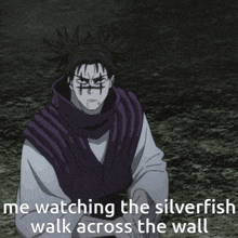 a man in a purple vest is watching the silverfish walk across the wall