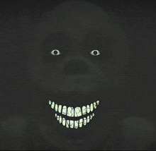 a drawing of a monster with glowing teeth and eyes